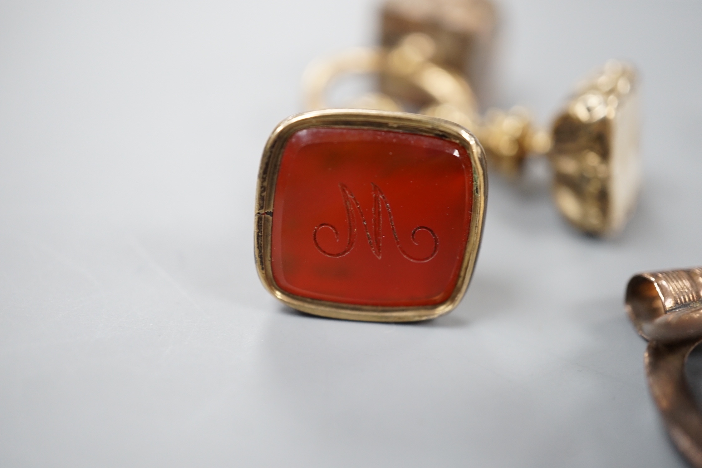 Six assorted Victorian and later mainly carnelian set fob seals including yellow metal overlaid and silver, largest 33mm.